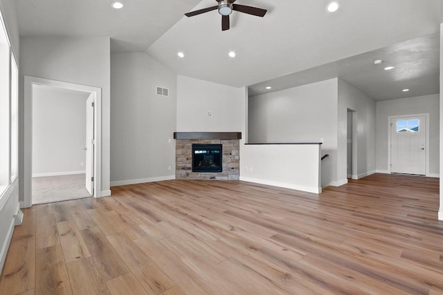 1925 Creekwood Ct, Manitowoc, WI 54220 - unfurnished living room with ceiling fan, light wood-type flooring, recessed lighting, baseboards, and vaulted ceiling
