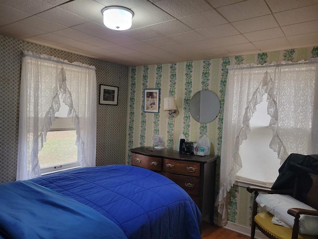 N9221 Sumac Ln, Gresham, WI 54128 - bedroom with wallpapered walls and wood finished floors