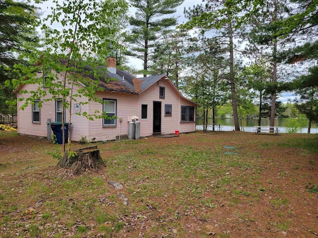 N9221 Sumac Ln, Gresham, WI 54128 - rear view of property with a water view and a chimney
