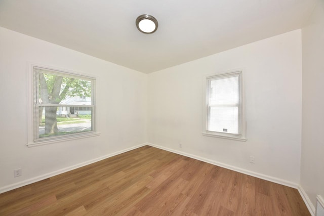 4757 N 21st St, Milwaukee, WI 53209 - spare room with light wood-type flooring and baseboards