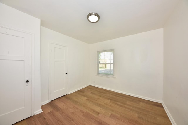 4757 N 21st St, Milwaukee, WI 53209 - unfurnished bedroom featuring light wood-style floors and baseboards