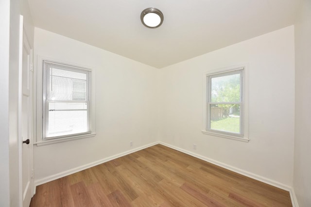 4757 N 21st St, Milwaukee, WI 53209 - empty room with light wood-style flooring and baseboards