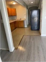 2405 S 5th St, Milwaukee, WI 53207 - hall with baseboards and light wood-style flooring