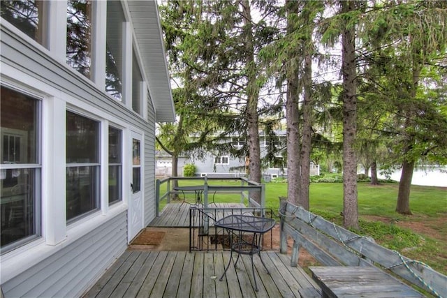 17174 59th Ave, Chippewa Falls, WI 54729 - wooden terrace featuring outdoor dining area and a lawn