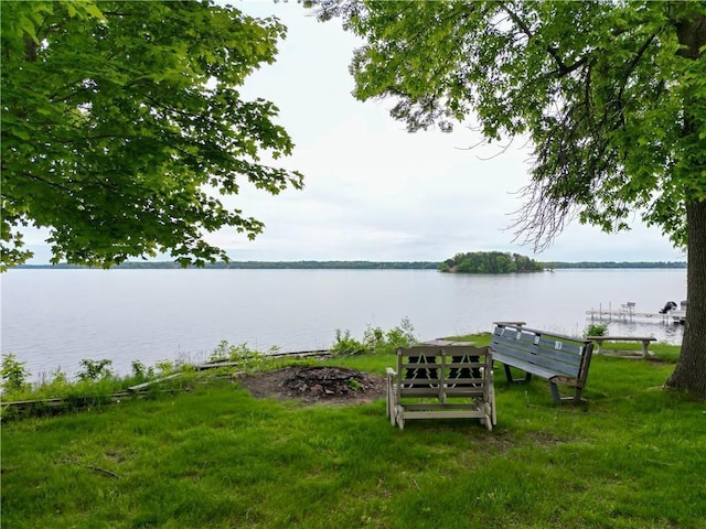 17174 59th Ave, Chippewa Falls, WI 54729 - view of grassy yard with a water view and a boat dock