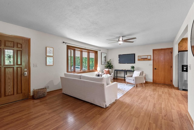 W188N10115 Maple Rd, Germantown, WI 53022 - living room with ceiling fan, light wood finished floors, and a textured ceiling