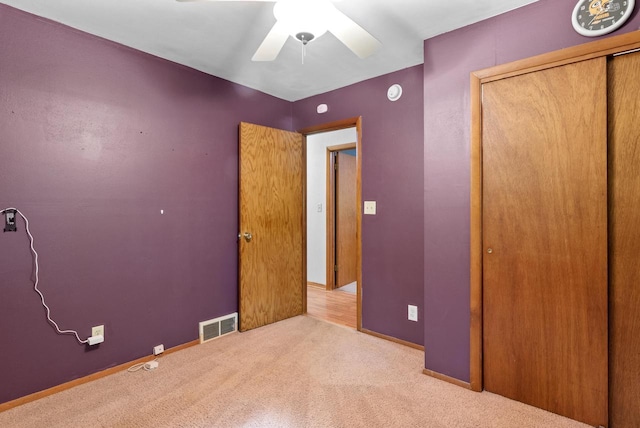 W188N10115 Maple Rd, Germantown, WI 53022 - unfurnished bedroom featuring carpet, a closet, and a ceiling fan