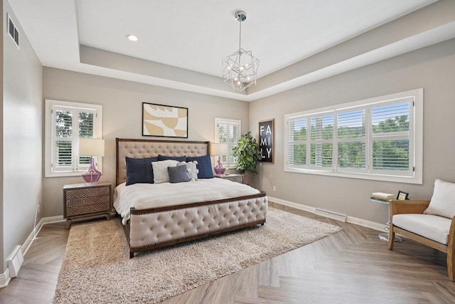 5570 Surrey Ln, Waunakee, WI 53597 - bedroom featuring a chandelier, baseboards, a raised ceiling, and recessed lighting