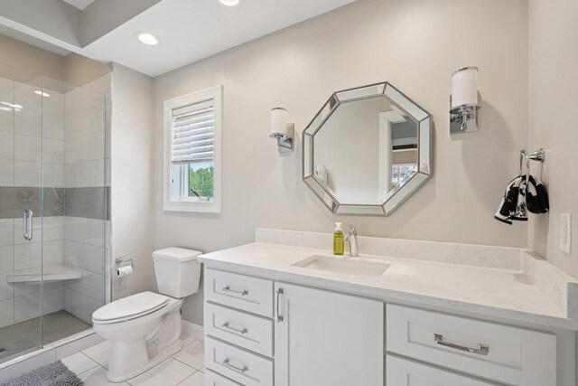 5570 Surrey Ln, Waunakee, WI 53597 - bathroom with vanity, toilet, a shower stall, tile patterned floors, and baseboards