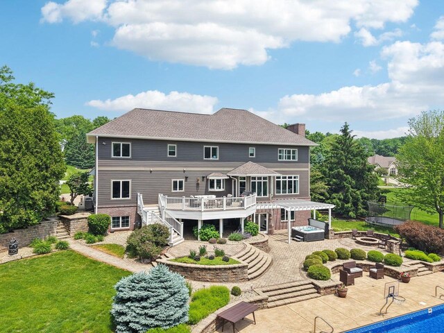 5570 Surrey Ln, Waunakee, WI 53597 - back of house featuring a fire pit, stairs, a deck, a patio, and a chimney