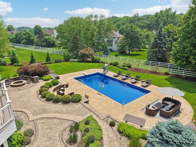 5570 Surrey Ln, Waunakee, WI 53597 - view of pool with an outdoor fire pit, a patio area, and a diving board