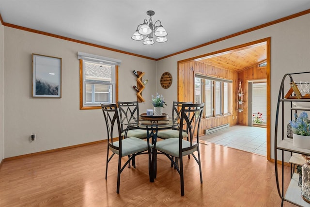 1001 S Matthias St, Appleton, WI 54915 - dining space featuring baseboard heating, light wood-style floors, vaulted ceiling, a chandelier, and baseboards