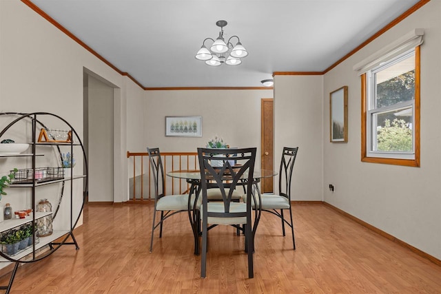 1001 S Matthias St, Appleton, WI 54915 - dining space featuring crown molding, a chandelier, light wood-style floors, and baseboards