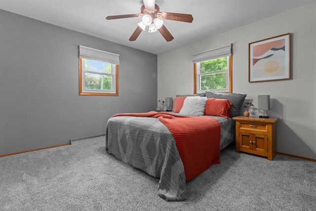 1001 S Matthias St, Appleton, WI 54915 - carpeted bedroom featuring a baseboard heating unit, baseboards, and a ceiling fan