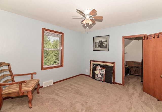 4900 S 67th St, Greenfield, WI 53220 - sitting room featuring light carpet, ceiling fan, and baseboards