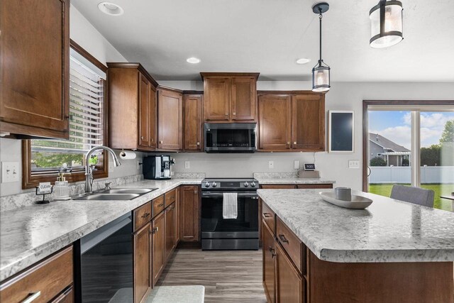 W6708 Prescott Dr, Greenville, WI 54942 - kitchen with electric range, a sink, plenty of natural light, dishwasher, and recessed lighting