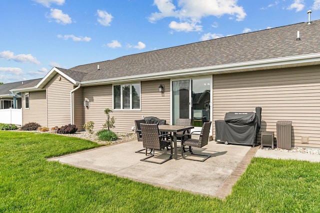 W6708 Prescott Dr, Greenville, WI 54942 - rear view of house with a patio, a lawn, and roof with shingles