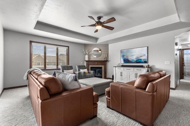 W6708 Prescott Dr, Greenville, WI 54942 - living area with a tray ceiling, light colored carpet, ceiling fan, and baseboards