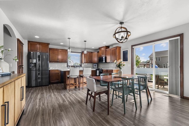 W6708 Prescott Dr, Greenville, WI 54942 - dining area featuring dark wood-type flooring, recessed lighting, a chandelier, and baseboards