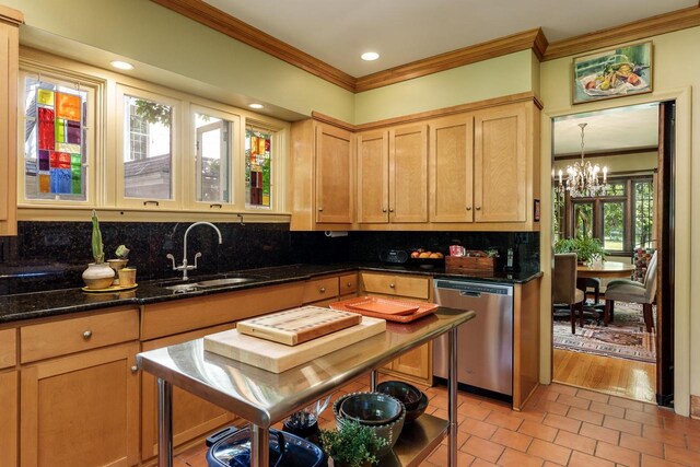 1705 Emerson St, Beloit, WI 53511 - kitchen featuring stainless steel dishwasher, a sink, ornamental molding, backsplash, and a chandelier