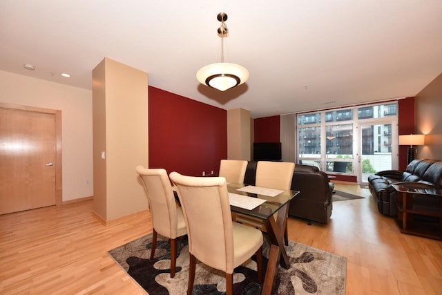 601 E Ogden Ave Unit 411, Milwaukee, WI 53202 - dining space featuring light wood-style floors