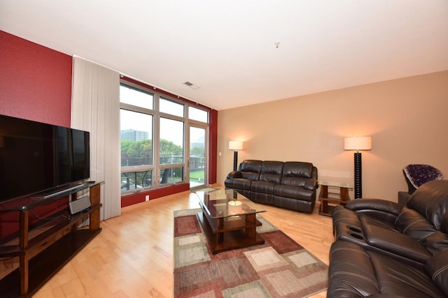 601 E Ogden Ave Unit 411, Milwaukee, WI 53202 - living room with light wood-style flooring