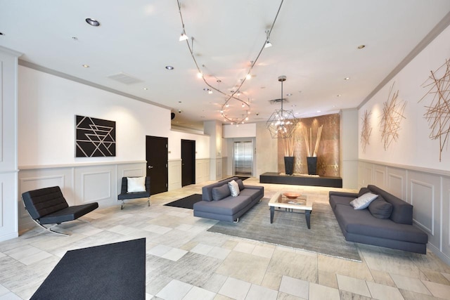 601 E Ogden Ave Unit 411, Milwaukee, WI 53202 - building lobby featuring a decorative wall, recessed lighting, and crown molding