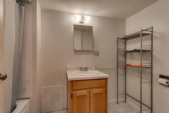 543 N Durkee St, Appleton, WI 54911 - bathroom featuring vanity,  shower combination, and tile patterned flooring