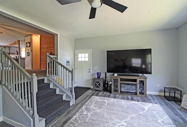 302 Lakeshore Dr, Avoca, WI 53506 - living area with wood finished floors, ceiling fan, and stairs