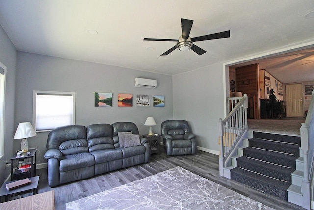 302 Lakeshore Dr, Avoca, WI 53506 - living area featuring a ceiling fan, an AC wall unit, wood finished floors, and stairs