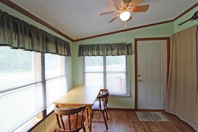 302 Lakeshore Dr, Avoca, WI 53506 - dining area with vaulted ceiling, ornamental molding, a textured ceiling, wood finished floors, and a ceiling fan