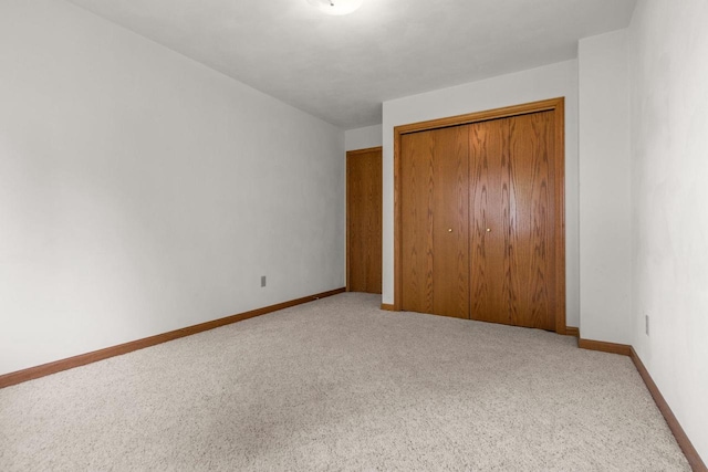 302 Parkside Ct, Kimberly, WI 54136 - unfurnished bedroom with carpet, a closet, and baseboards