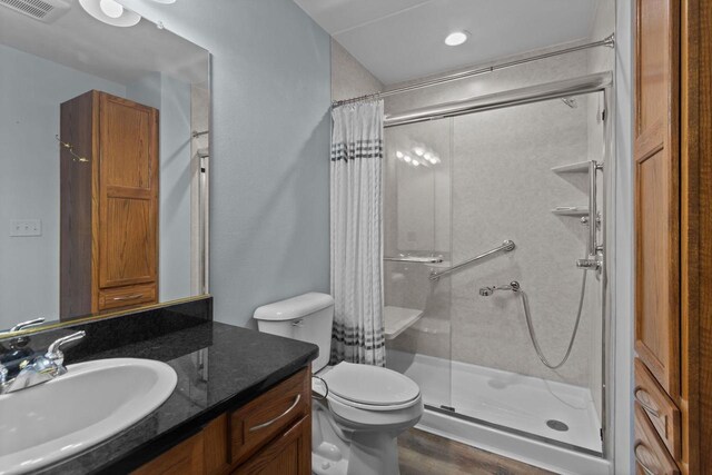 302 Parkside Ct, Kimberly, WI 54136 - full bathroom featuring a shower stall, vanity, toilet, and wood finished floors