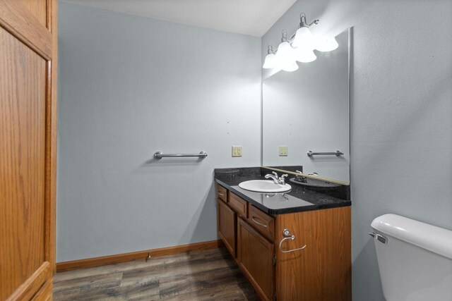 302 Parkside Ct, Kimberly, WI 54136 - bathroom with vanity, wood finished floors, and toilet