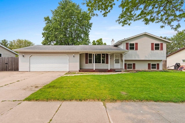 57 Solar Cir, Appleton, WI 54915 - split level home with a garage, driveway, a chimney, and covered porch