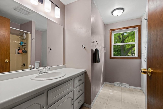 57 Solar Cir, Appleton, WI 54915 - full bathroom featuring vanity, baseboards, tile patterned floors, a shower, and toilet