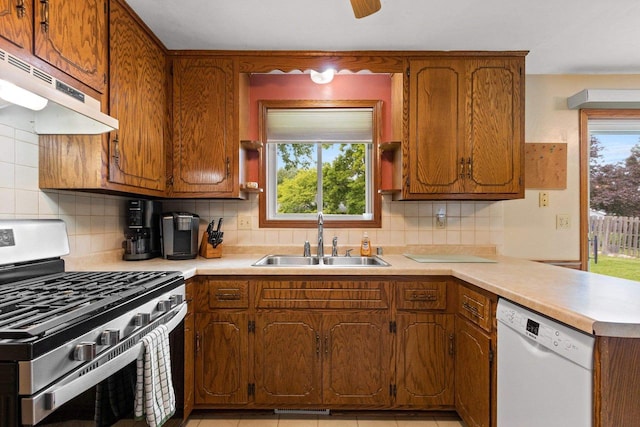 57 Solar Cir, Appleton, WI 54915 - kitchen featuring stainless steel gas range oven, a sink, dishwasher, under cabinet range hood, and light countertops
