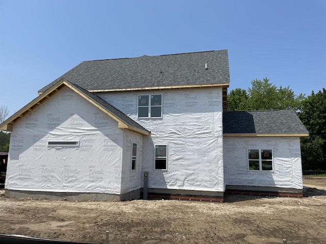 9420 W Huntington Dr, Mequon, WI 53097 - rear view of property featuring a shingled roof