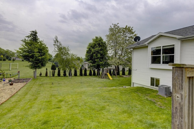 S5472 Mammoth Trl, Baraboo, WI 53913 - view of green lawn with cooling unit and a playground