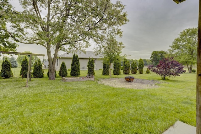 S5472 Mammoth Trl, Baraboo, WI 53913 - view of green lawn featuring a fire pit