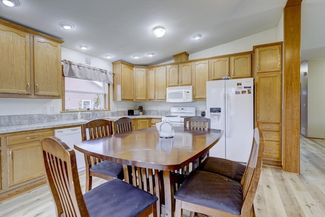 S5472 Mammoth Trl, Baraboo, WI 53913 - kitchen with white appliances, light wood-style flooring, lofted ceiling, and light countertops