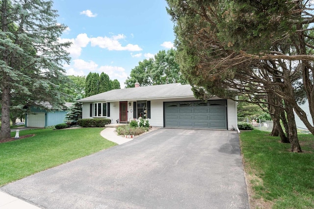 2806 Maple Grove Dr, Madison, WI 53719 - single story home with a garage, asphalt driveway, a front lawn, and a chimney