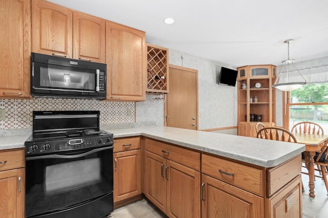 2806 Maple Grove Dr, Madison, WI 53719 - kitchen featuring black appliances, a peninsula, light countertops, and tasteful backsplash