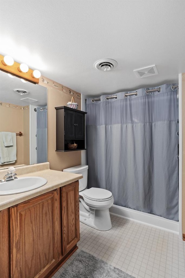 2806 Maple Grove Dr, Madison, WI 53719 - full bathroom with vanity, toilet, and a shower with shower curtain