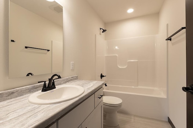 910-920 Green Pastures Trl, Plover, WI 54467 - bathroom with vanity, toilet, shower / tub combination, wood finished floors, and recessed lighting