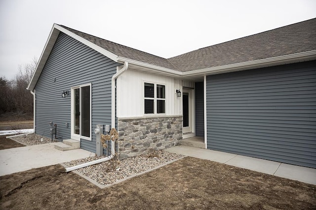 910-920 Green Pastures Trl, Plover, WI 54467 - entrance to property with a shingled roof and stone siding