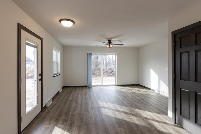 910-920 Green Pastures Trl, Plover, WI 54467 - empty room featuring a ceiling fan, dark wood finished floors, and baseboards