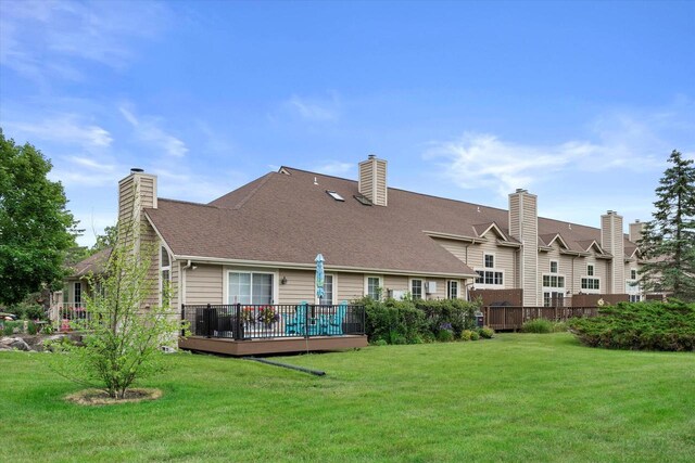 2975 River Birch Dr Unit E, Brookfield, WI 53045 - rear view of property with a deck, a lawn, and a chimney
