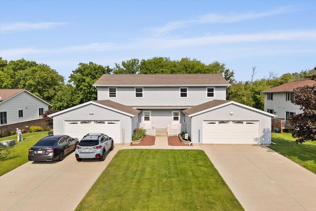 1529 Vogt Dr, West Bend, WI 53095 - traditional home featuring a detached garage, a front yard, and an outdoor structure