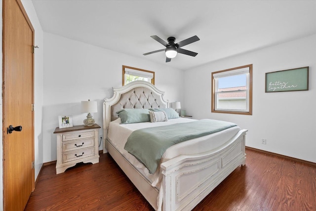 1529 Vogt Dr, West Bend, WI 53095 - bedroom with dark wood-style floors, baseboards, and ceiling fan